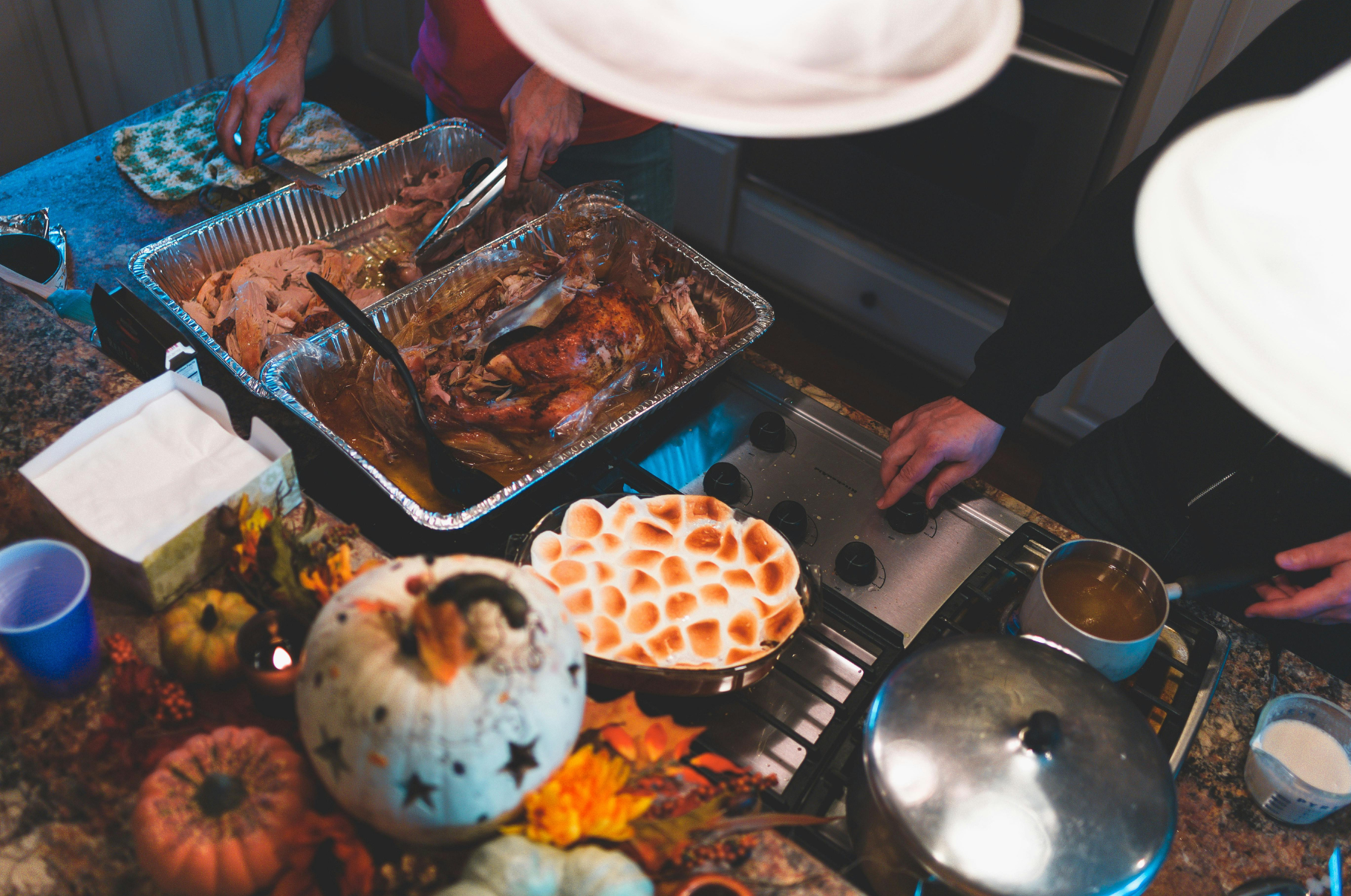 Image of Warm Thanksgiving kitchen scene with roasted turkey, sweet potato casserole, and fall décor — capturing the spirit of holiday cooking and shared meals inspired by Pro Chefly’s culinary artistry.